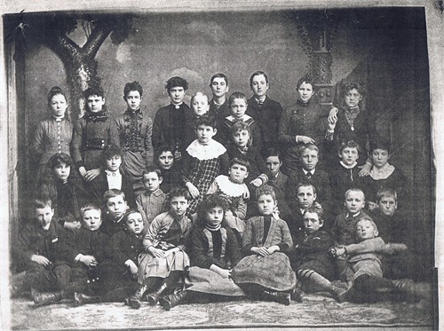 Foldens Corners School Photo mid 1880s. Margaret 4th from the left in the back row.  Her brother Harry (boy in front furthest right)