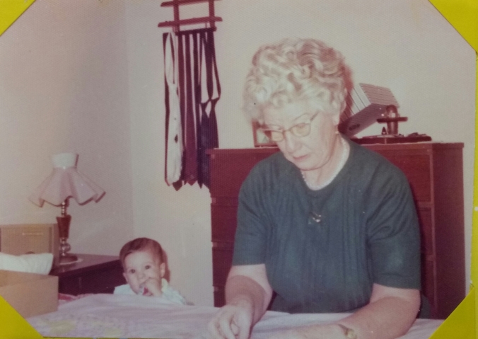 Grandma quilting with me looking on in 1975